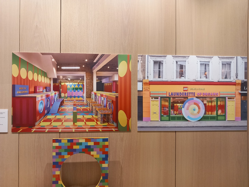 A wall display of photos, showing a brightly coloured launderette