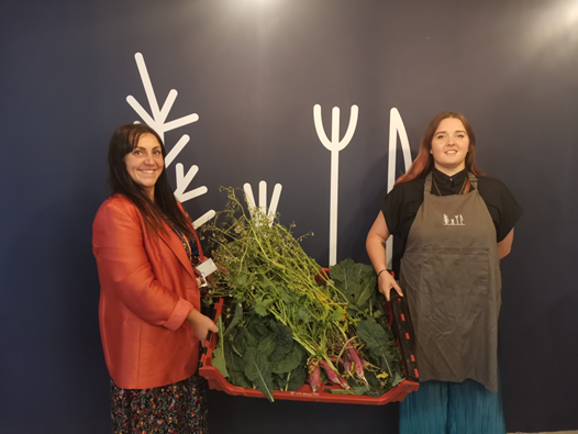 Teacher Julia Mottershead and Rachael Colerick from Feasted show off their allotment-grown food